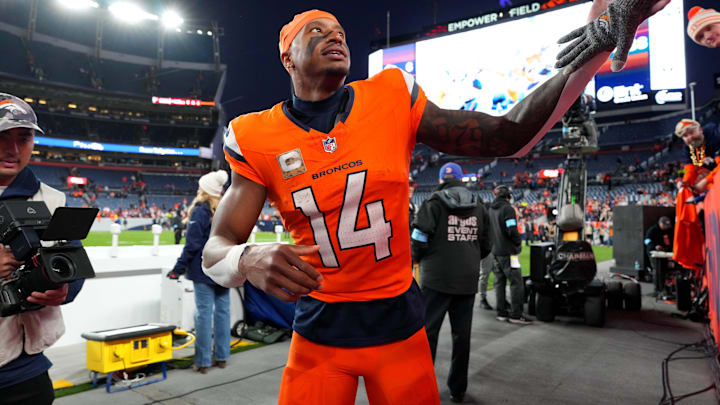 Nov 17, 2024; Denver, Colorado, USA; Denver Broncos wide receiver Courtland Sutton (14) following the win over the Atlanta Falcons at Empower Field at Mile High. Mandatory Credit: Ron Chenoy-Imagn Images