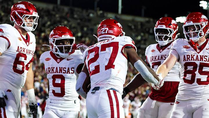 Arkansas Razorbacks running back celebrates with teammates after scoring his second touchdown against Vanderbilt. Arkansas Razorbacks running back celebrates with teammates after scoring his second touchdown against Vanderbilt.