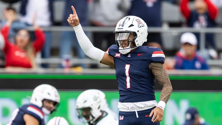 Nov 22, 2025; Tucson, Arizona, USA; Arizona Wildcats quarterback Noah Fifita (1) celebrates a touchdown against the Baylor Bears in the second half at Casino Del Sol Stadium. Mandatory Credit: Mark J. Rebilas-Imagn Images