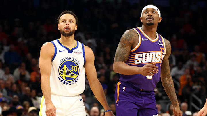 Dec 12, 2023; Phoenix, Arizona, USA; Golden State Warriors guard Stephen Curry (30) against Phoenix Suns guard Bradley Beal (3) at Footprint Center. Mandatory Credit: Mark J. Rebilas-Imagn Images