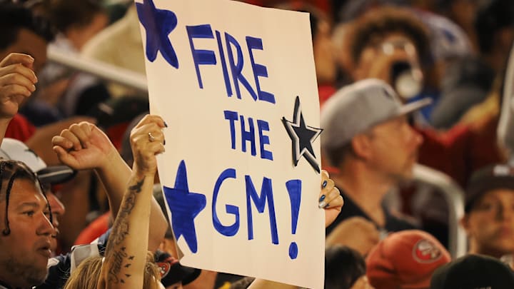 A Dallas Cowboys fan holds a sign reading “fire the GM” during the second quarter against the San Francisco 49ers at Levi's Stadium. Mandatory Credit: Kelley L Cox-Imagn Images