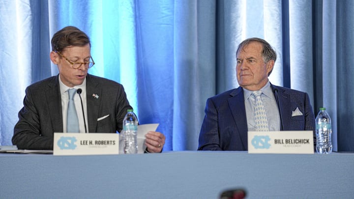 Dec 12, 2024; Chapel Hill, NC, USA; North Carolina Tar Heels chancellor Lee Roberts reads a transcript about new head coach Bill Belichicksí father who served as an assistant coach at New North Carolina Tar Heels new in 1954 at Loudermilk Center for Excellence. Mandatory Credit: Jim Dedmon-Imagn Images Dec 12, 2024; Chapel Hill, NC, USA; North Carolina Tar Heels chancellor Lee Roberts reads a transcript about new head coach Bill Belichicksí father who served as an assistant coach at New North Carolina Tar Heels new in 1954 at Loudermilk Center for Excellence. Mandatory Credit: Jim Dedmon-Imagn Images