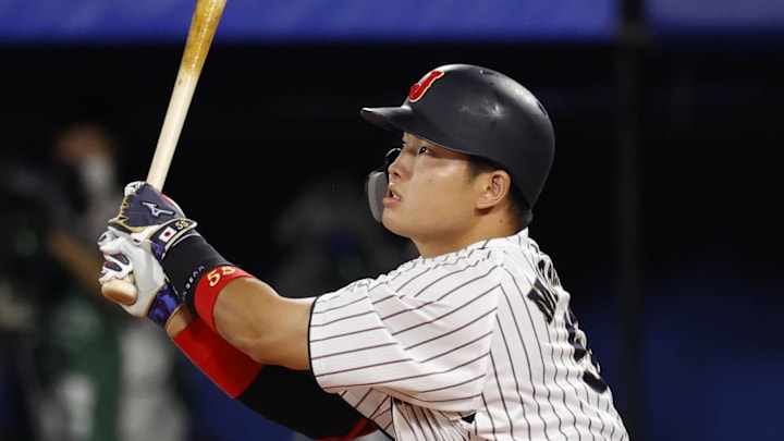 Aug 7, 2021; Yokohama, Japan; Team Japan infielder Munetaka Murakami (55) hits a solo home run against USA during the third inning in the baseball gold medal match during the Tokyo 2020 Olympic Summer Games at Yokohama Baseball Stadium. Mandatory Credit: Yukihito Taguchi-Imagn Images