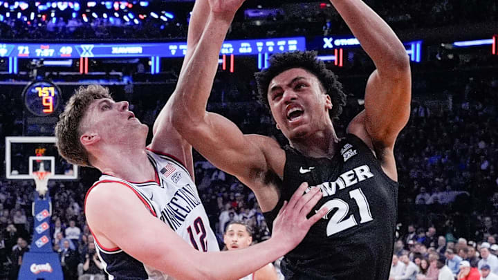 Mar 12, 2026; New York, NY, USA; UConn Huskies center Eric Reibe (12) stops Xavier Musketeers forward Anthony Robinson (21) during the second half at Madison Square Garden. Mandatory Credit: Robert Deutsch-Imagn Images Mar 12, 2026; New York, NY, USA; UConn Huskies center Eric Reibe (12) stops Xavier Musketeers forward Anthony Robinson (21) during the second half at Madison Square Garden. Mandatory Credit: Robert Deutsch-Imagn Images