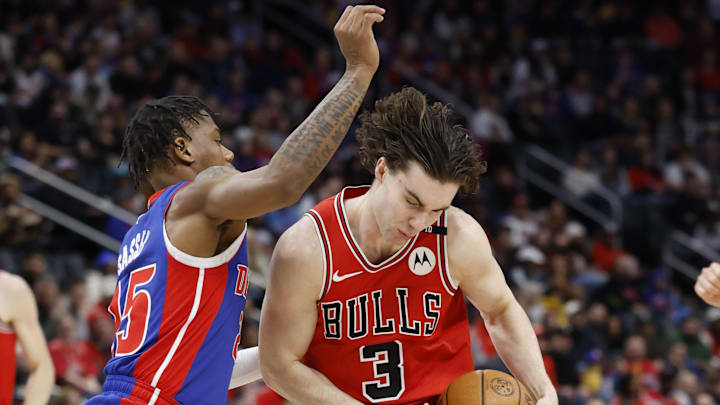 Feb 2, 2025; Detroit, Michigan, USA; Chicago Bulls guard Josh Giddey (3) dribbles defended by Detroit Pistons guard Marcus Sasser (25) in the first half at Little Caesars Arena. Mandatory Credit: Rick Osentoski-Imagn Images