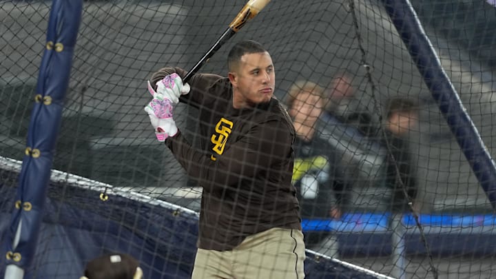 May 20, 2025; Toronto, Ontario, CAN; San Diego Padres third baseman Manny Machado (13) takes batting practice before a game against the Toronto Blue Jays at Rogers Centre. Mandatory Credit: Nick Turchiaro-Imagn Images