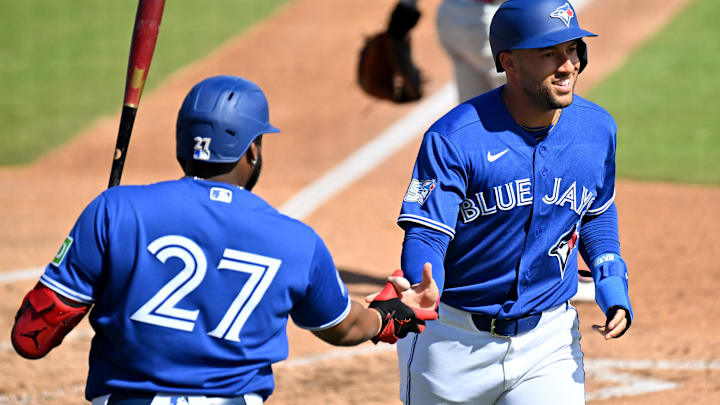 Feb 28, 2026; Dunedin, Florida, USA; Toronto Blue Jays designated hitter George Springer (4) celebrates with first baseman Vladimir Guerrero Jr. (27) after scoring a run in the third inning against the Philadelphia Phillies during spring training at TD Ballpark. Mandatory Credit: Jonathan Dyer-Imagn Images Feb 28, 2026; Dunedin, Florida, USA; Toronto Blue Jays designated hitter George Springer (4) celebrates with first baseman Vladimir Guerrero Jr. (27) after scoring a run in the third inning against the Philadelphia Phillies during spring training at TD Ballpark. Mandatory Credit: Jonathan Dyer-Imagn Images