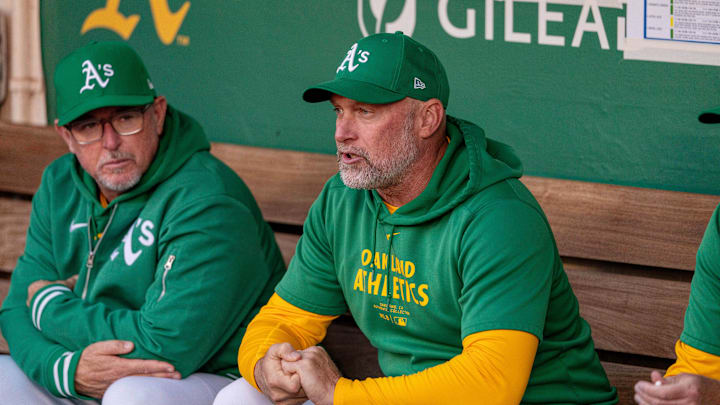 Sep 24, 2024; Oakland, California, USA; Oakland Athletics manager Mark Kotsay (7) before the start of the game shouts encouragement to the players as they take the field against the Texas Rangers at Oakland-Alameda County Coliseum. Mandatory Credit: Neville E. Guard-Imagn Images