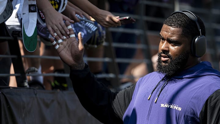 Sep 15, 2024; Baltimore, Maryland, USA;  Baltimore Ravens defensive tackle Broderick Washington (96) high fives fans before the game against the Las Vegas Raiders at M&T Bank Stadium. Mandatory Credit: Tommy Gilligan-Imagn Images