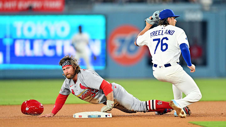 Aug 5, 2025: Los Angeles Dodgers shortstop Alex Freeland (76) tags out St. Louis Cardinals second base Brendan Donovan (33) at second base during the third inning at Dodger Stadium. Aug 5, 2025: Los Angeles Dodgers shortstop Alex Freeland (76) tags out St. Louis Cardinals second base Brendan Donovan (33) at second base during the third inning at Dodger Stadium.