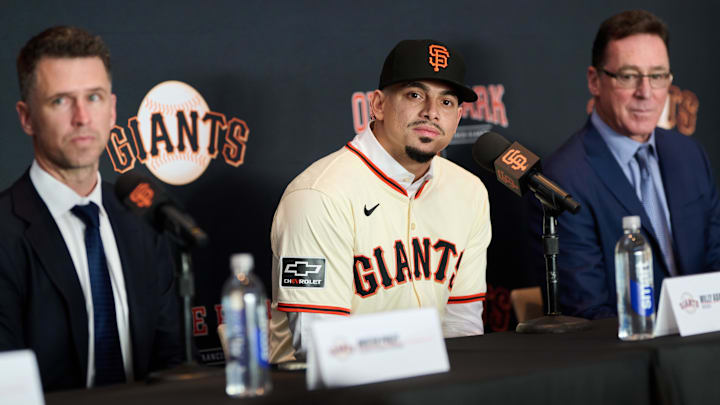 Dec 12, 2024; San Francisco, CA, USA; San Francisco Giants shortstop Willy Adames listens during his introductory press conference with president of baseball operations Buster Posey (left) and manager Bob Melvin (right) at Oracle Park. Dec 12, 2024; San Francisco, CA, USA; San Francisco Giants shortstop Willy Adames listens during his introductory press conference with president of baseball operations Buster Posey (left) and manager Bob Melvin (right) at Oracle Park.