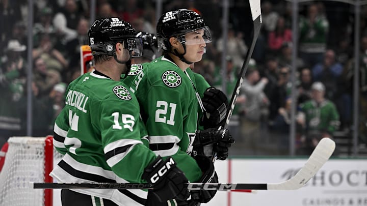 Dec 8, 2024; Dallas, Texas, USA; Dallas Stars center Colin Blackwell (15) and left wing Jason Robertson (21) and defenseman Miro Heiskanen (4) celebrate during the game between the Dallas Stars and the Calgary Flames at American Airlines Center. Mandatory Credit: Jerome Miron-Imagn Images
