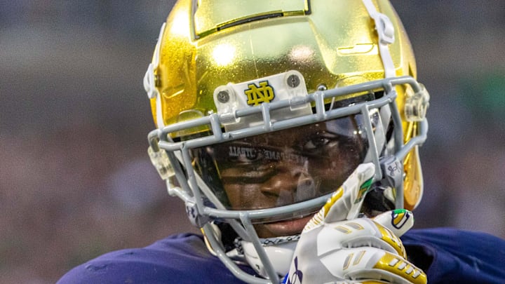 Sep 20, 2025; South Bend, Indiana, USA; A Notre Dame Fighting Irish running back Jeremiyah Love (4) points to the crowd after scoring against the Purdue Boilermakers during the second half at Notre Dame Stadium. Mandatory Credit: Michael Caterina-Imagn Images