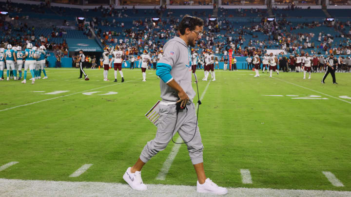 Miami Dolphins head coach Mike McDaniel walks on the sideline against the Washington Commanders during the fourth quarter of a preseason game at Hard Rock Stadium.