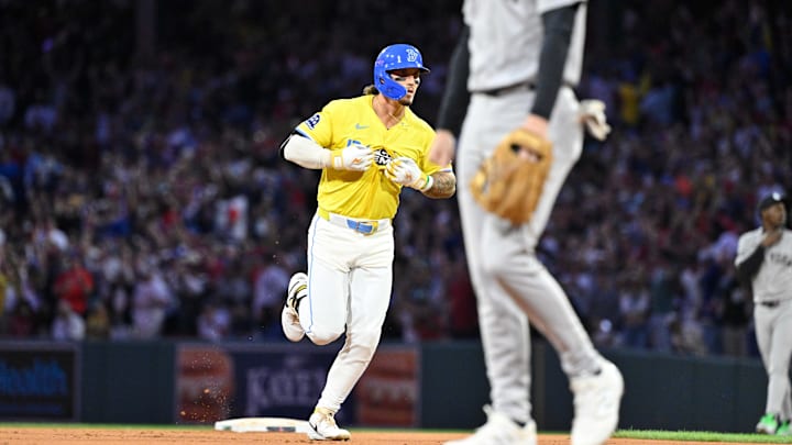 Sep 13, 2025; Boston, Massachusetts, USA; Boston Red Sox outfielder Jarren Duran (16) unbuttons his jersey to partially display his t-shirt after hitting a one-run home run during the eighth inning against the New York Yankees at Fenway Park. Mandatory Credit: Eric Canha-Imagn Images