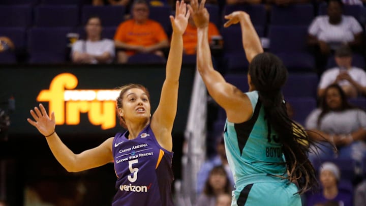 Mercury's  Leilani Mitchell (5) defends Liberty's Brittany Boyd (15) as she shoots during the first half at Talking Stick Resort Arena in Phoenix, Ariz. on Aug. 19, 2018. 

865709002