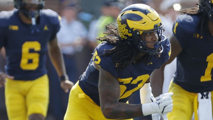 Sep 14, 2024; Ann Arbor, Michigan, USA; Michigan Wolverines defensive end Kechaun Bennett (52) rushes on defense against the Arkansas State Red Wolves at Michigan Stadium. Mandatory Credit: Rick Osentoski-Imagn Images