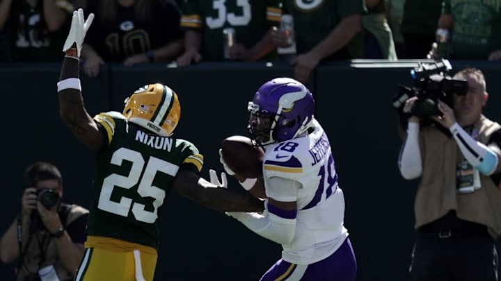 Vikings receiver Justin Jefferson scores against Packers cornerback Keisean Nixon on Sunday at Lambeau Field.