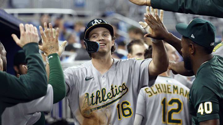 May 4, 2025; Miami, Florida, USA;  Oakland Athletics first baseman Nick Kurtz (16) is greeted in the dugout by teammates after scoring against the Miami Marlins during the ninth inning at loanDepot Park. Mandatory Credit: Rhona Wise-Imagn Images