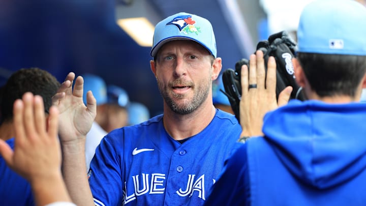 Mar 14, 2026; Dunedin, Florida, USA; Toronto Blue Jays starting pitcher Max Scherzer (31) is congratulated in the dugout after he pitched against the Toronto Blue Jays at TD Ballpark. Mandatory Credit: Kim Klement Neitzel-Imagn Images Mar 14, 2026; Dunedin, Florida, USA; Toronto Blue Jays starting pitcher Max Scherzer (31) is congratulated in the dugout after he pitched against the Toronto Blue Jays at TD Ballpark. Mandatory Credit: Kim Klement Neitzel-Imagn Images