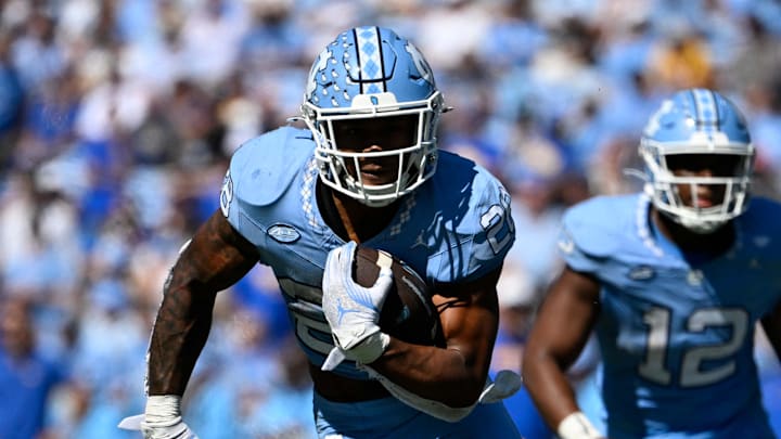 Oct 5, 2024; Chapel Hill, North Carolina, USA; North Carolina Tar Heels running back Omarion Hampton (28) runs in the second quarter at Kenan Memorial Stadium. Mandatory Credit: Bob Donnan-Imagn Images