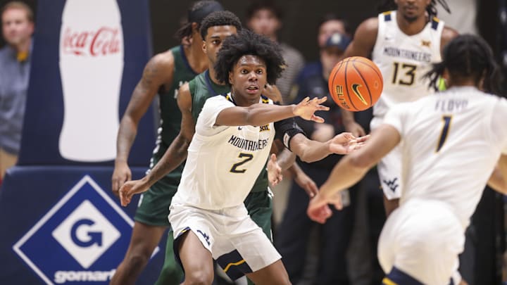 Nov 30, 2025; Morgantown, West Virginia, USA; West Virginia Mountaineers guard Amir Jenkins (2) passes the ball to West Virginia Mountaineers guard Jasper Floyd (1) during the first half against the Mercyhurst Lakers at Hope Coliseum. Mandatory Credit: Ben Queen-Imagn Images