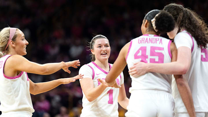 Iowa guard Kylie Feuerbach (4), Iowa guard Taylor Stremlow (1), Iowa forward Hannah Stuelke (45) and Iowa center Ava Heiden (5) huddle during a game against the Washington Huskies Feb. 11, 2026 at Carver-Hawkeye Arena in Iowa City, Iowa.