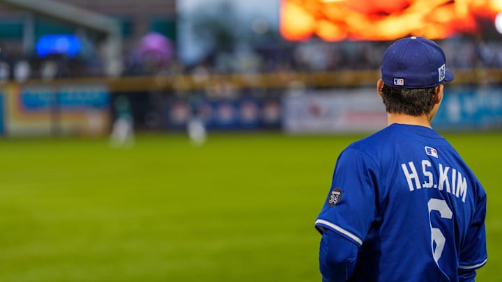 Los Angeles Dodgers infielder Hyeseong Kim (6) looks on during warm-ups for a spring training game between the Seattle Mariners at Peoria Sports Complex on March 7.