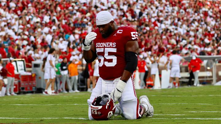 Oklahoma offensive lineman Eddy Pierre-Louis prays before facing New Mexico.
