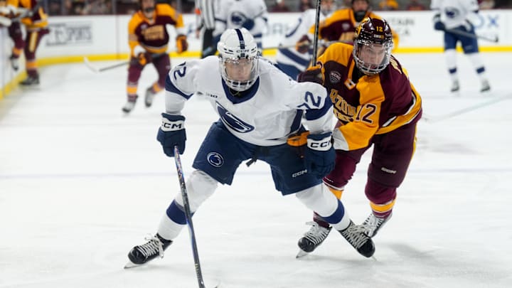 Penn State hockey forward Gavin McKenna (72) skates against Arizona State Cullen Potter (12) during the second period at Mullett Arena