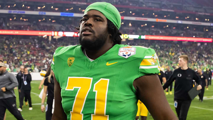 Jan 1, 2024; Glendale, AZ, USA; Oregon Ducks offensive lineman George Silva (71) against the Liberty Flames during the 2024 Fiesta Bowl at State Farm Stadium. Mandatory Credit: Mark J. Rebilas-Imagn Images Jan 1, 2024; Glendale, AZ, USA; Oregon Ducks offensive lineman George Silva (71) against the Liberty Flames during the 2024 Fiesta Bowl at State Farm Stadium. Mandatory Credit: Mark J. Rebilas-Imagn Images