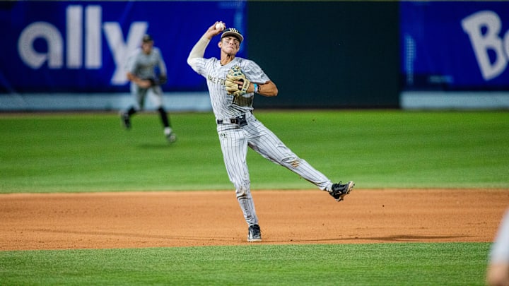 May 24, 2024; Charlotte, NC, USA; Wake Forest infielder Marek Houston (7) throws home for an out against the North Carolina Tar Heels in the eleventh inning during the ACC Baseball Tournament at Truist Field. 
