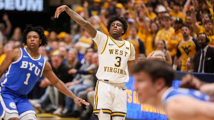 Feb 28, 2026; Morgantown, West Virginia, USA; West Virginia Mountaineers guard Honor Huff (3) shoots a three point shot over BYU Cougars guard Robert Wright III (1) during the second half at Hope Coliseum. Mandatory Credit: Ben Queen-Imagn Images Feb 28, 2026; Morgantown, West Virginia, USA; West Virginia Mountaineers guard Honor Huff (3) shoots a three point shot over BYU Cougars guard Robert Wright III (1) during the second half at Hope Coliseum. Mandatory Credit: Ben Queen-Imagn Images