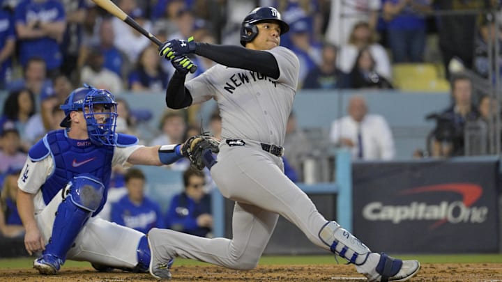 Oct 26, 2024; Los Angeles, California, USA; New York Yankees outfielder Juan Soto (22) hits a solo home run in the third inning against the Los Angeles Dodgers during game two of the 2024 MLB World Series at Dodger Stadium. Mandatory Credit: Jayne Kamin-Oncea-Imagn Images