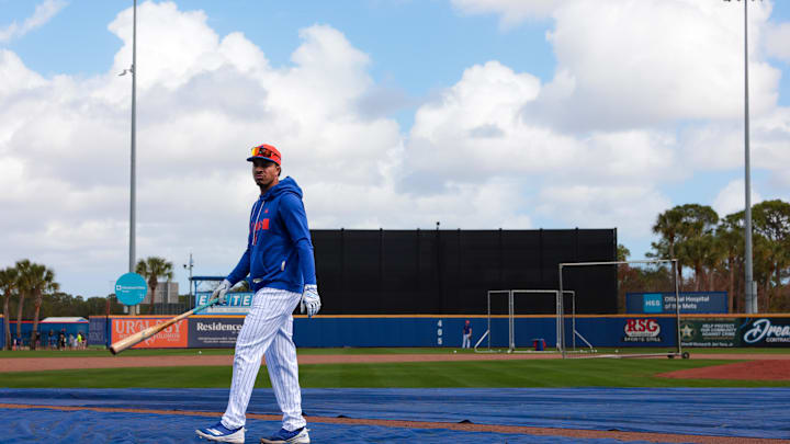 Feb 17, 2026; Port St. Lucie, FL, USA; New York Mets infielder Mark Vientos (27) walks on the field with a bat during spring training at Clover Park. Mandatory Credit: Sam Navarro-Imagn Images
