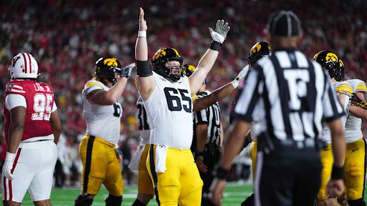Oct 11, 2025; Madison, Wisconsin, USA; Iowa Hawkeyes offensive lineman Logan Jones (65) celebrates a touchdown in the first half against the Wisconsin Badgers at Camp Randall Stadium. Mandatory Credit: Ross Harried-Imagn Images Oct 11, 2025; Madison, Wisconsin, USA; Iowa Hawkeyes offensive lineman Logan Jones (65) celebrates a touchdown in the first half against the Wisconsin Badgers at Camp Randall Stadium. Mandatory Credit: Ross Harried-Imagn Images