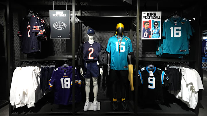 Oct 11, 2024; London, United Kingdom; The jerseys of Chicago Bears wide receiver DJ Moore (2),Jacksonville Jaguars quarterback Trevor Lawrence (16), Minnesota Vikings receiver Justin Jefferson (18) and Carolina Panthers quarterback Bryce Young (9) at Nike Town London. Mandatory Credit: Kirby Lee-Imagn Images