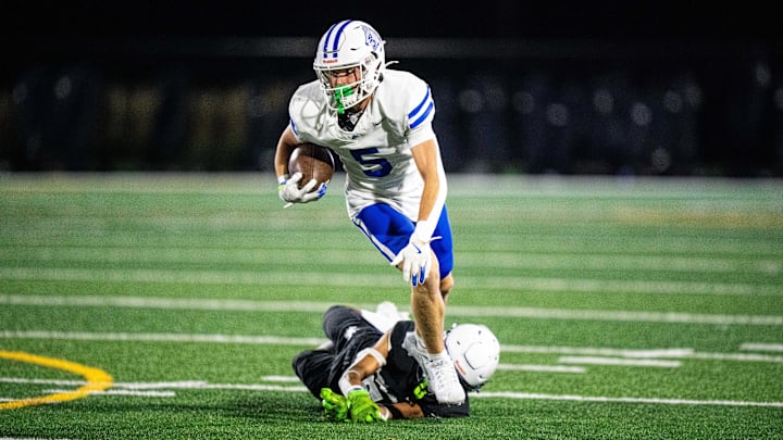 Waukee Northwest's Jordon Green (6) shakes off his Roosevelt defender on Thursday, Sept. 12, 2024, at Mediacom Stadium in Des Moines.