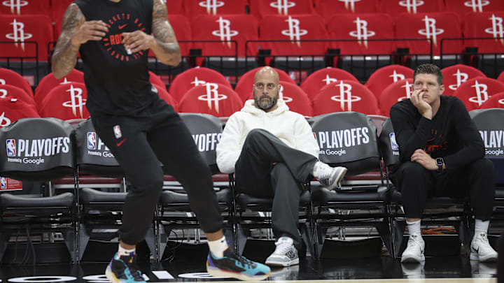 May 4, 2025; Houston, Texas, USA; Houston Rockets general manager Rafael Stone  (middle) watches during warmups before game seven of first round for the 2025 NBA Playoffs against the Golden State Warriors at Toyota Center. Mandatory Credit: Troy Taormina-Imagn Images