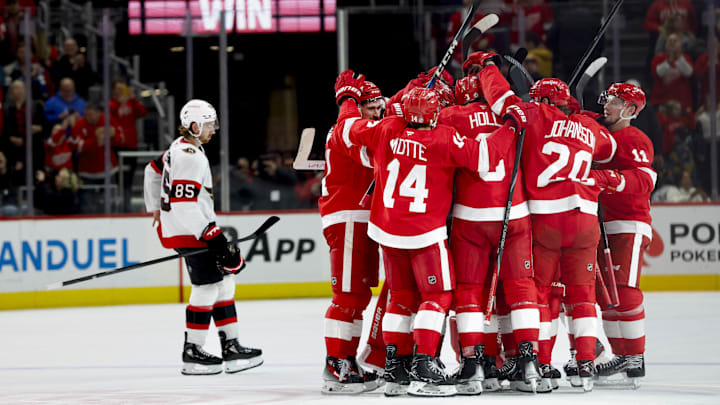 Jan 7, 2025; Detroit, Michigan, USA; Detroit Red Wings right wing Patrick Kane (88) receives congratulations from teammates after scoring in overtime against the Ottawa Senators at Little Caesars Arena. Mandatory Credit: Rick Osentoski-Imagn Images