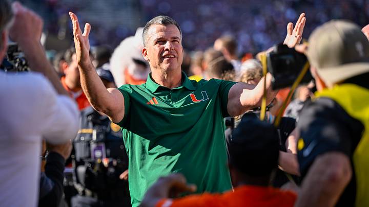 Dec 20, 2025; College Station, TX, USA; Miami Hurricanes head coach Mario Cristobal celebrates as he walks off the field after the Hurricanes win over the Texas A&M Aggies at Kyle Field. Mandatory Credit: Jerome Miron-Imagn Images Dec 20, 2025; College Station, TX, USA; Miami Hurricanes head coach Mario Cristobal celebrates as he walks off the field after the Hurricanes win over the Texas A&M Aggies at Kyle Field. Mandatory Credit: Jerome Miron-Imagn Images