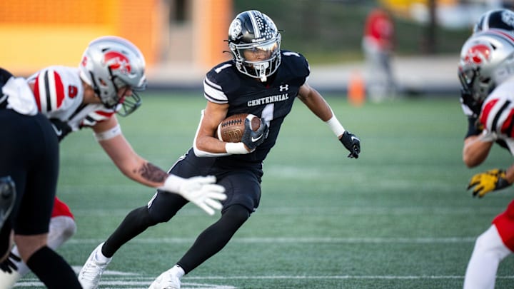 Ankeny Centennial's Braeden Jackson (1) runs down the field during a playoff game against Iowa City High on Friday, Nov. 1, 2024, at Ankeny Stadium.