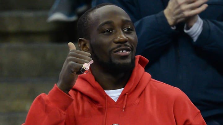 Light welterweight boxing champion Terence Crawford acknowledges the crowd during a break in the game between the Creighton Bluejays and the Longwood Lancers.