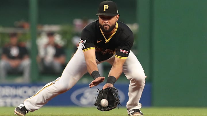 Jul 21, 2025; Pittsburgh, Pennsylvania, USA;  Pittsburgh Pirates shortstop Isiah Kiner-Falefa (7) fields a ground ball for an out against Detroit Tigers shortstop Trey Sweeney (not pictured during the seventh inning PNC Park. Mandatory Credit: Charles LeClaire-Imagn Images