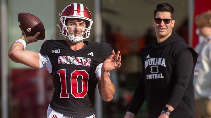 Indiana's Josh Hoover (10) throws in front of Tino Sunseri during spring practice at Memorial Stadium on Tuesday, March 31, 2026.