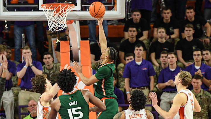 Feb 4, 2023; Clemson, South Carolina, USA; Miami guard Isaiah Wong (2) scores near Clemson guard