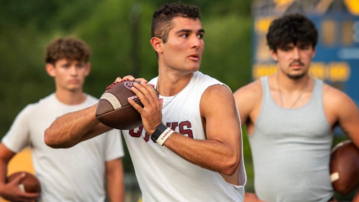 Dante Reno throws during a drill at the M2 QB Academy on Monday, July 31.