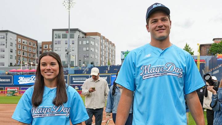 Ann Michael and Drake Maye walk across the field at Polar Park before the inaugural MayeDay Celebrity Softball Classic May 31. Ann Michael and Drake Maye walk across the field at Polar Park before the inaugural MayeDay Celebrity Softball Classic May 31.