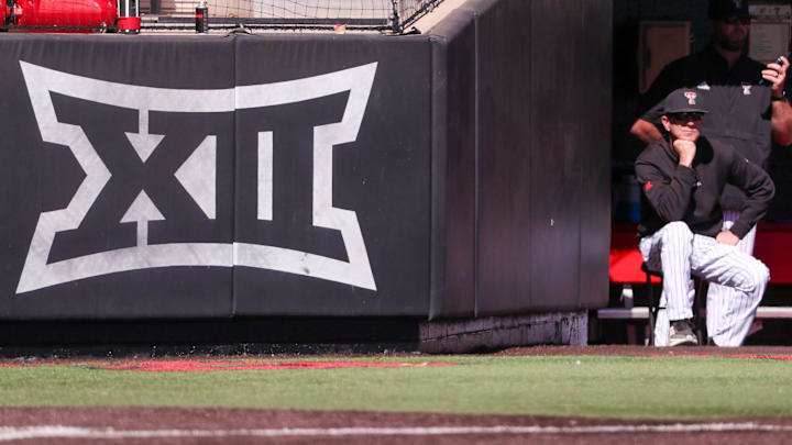 Texas Tech head coach Tim Tadlock sits next to the Big 12 Conference logo during a non-conference Division I baseball game, Wednesday, March 5, 2025, at Dan Law Field.