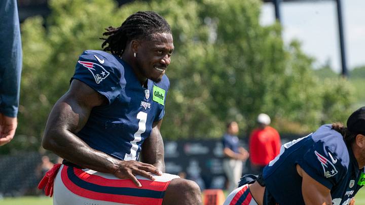 New England Patriots wide receiver A.J. Brown stretches during a joint practice against the Philadelphia Eagles. New England Patriots wide receiver A.J. Brown stretches during a joint practice against the Philadelphia Eagles.